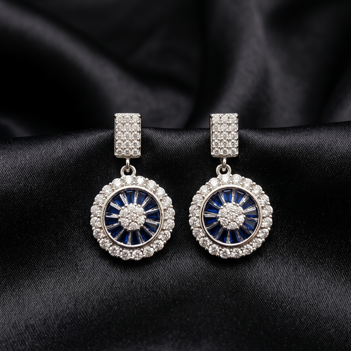 Silver Crystal Medallion Drop Earrings with Blue Stones
